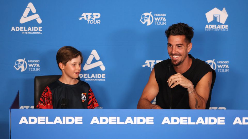 Thanasi Kokkinakis is interviewed by 11-year-old Max, a SA State League player, at the Adelaide International.